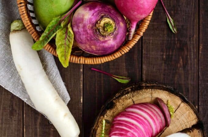 a bowl of different types of radishes