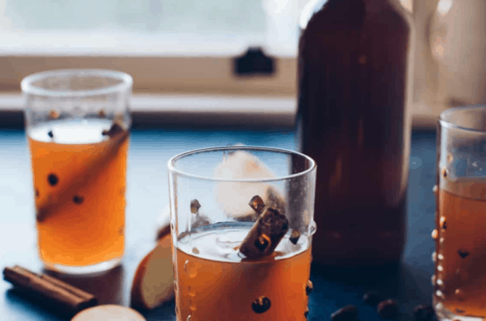 hard cider in glass and bottle