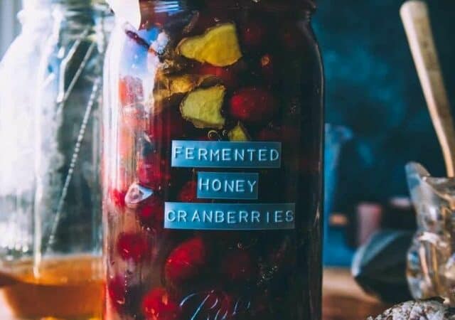 fermented honey cranberries in mason jar