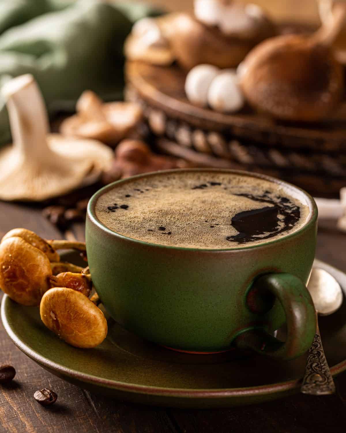 A green coffee mug surrounded by mushrooms. 